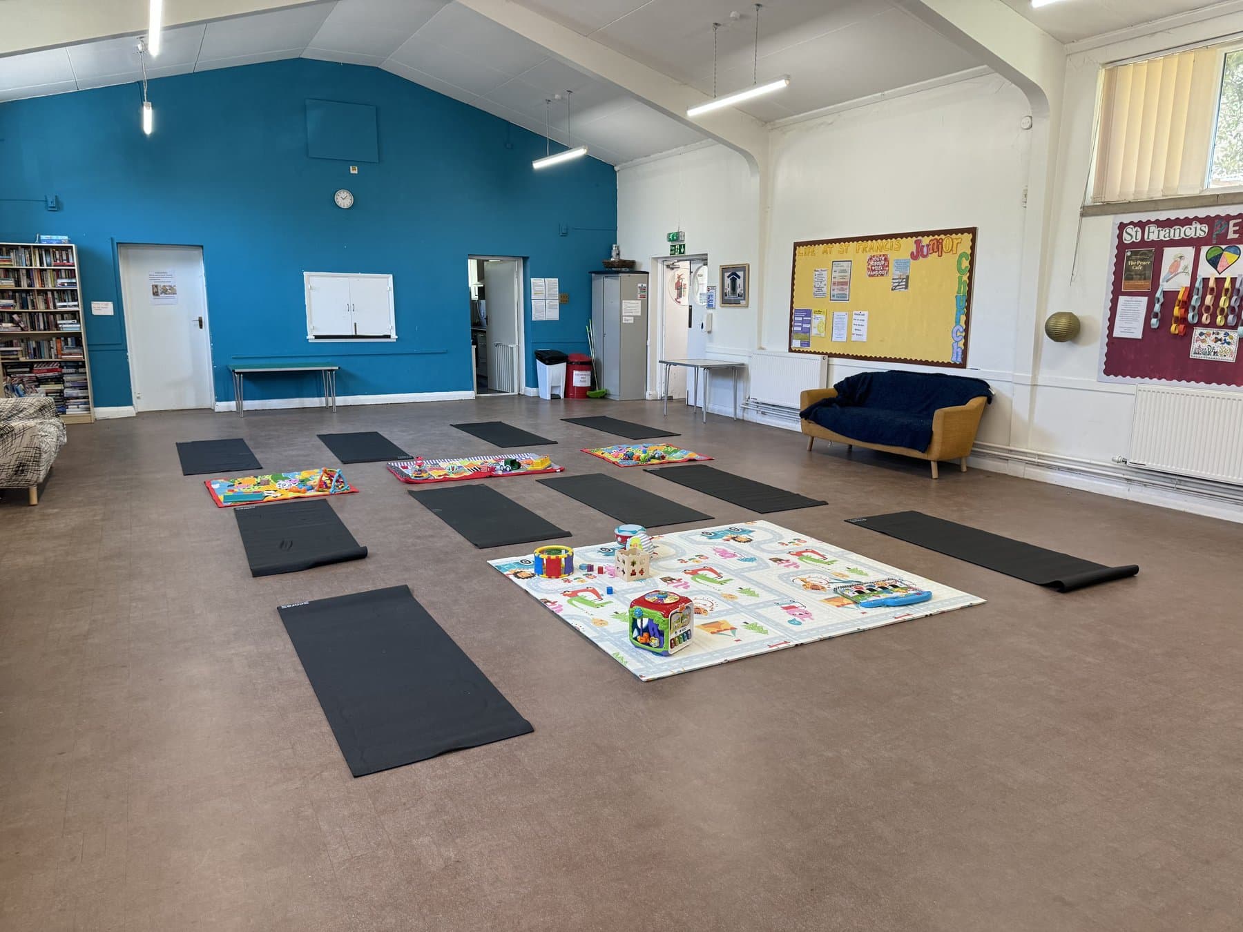 Bright studio space set up for a parent and baby fitness class